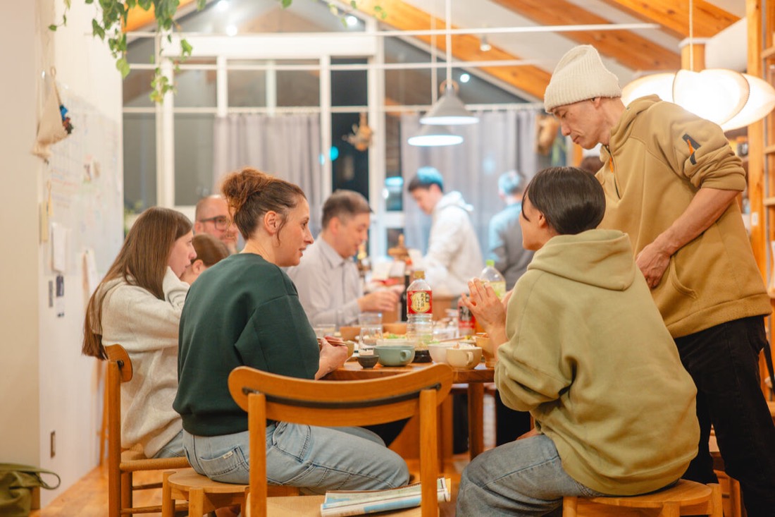 Neighbors and guests around a dinner table in Kamakura