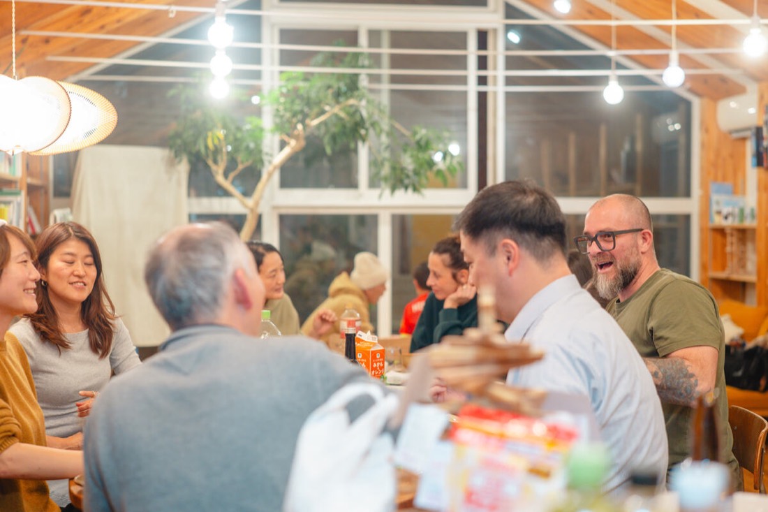 Guests and hosts sharing dinner